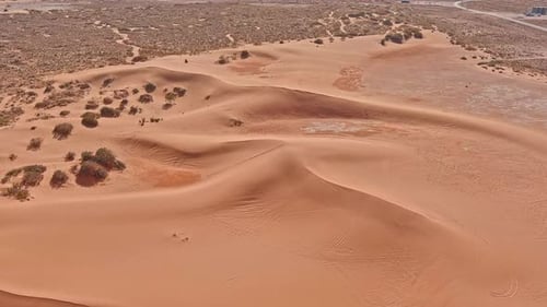 Aerial view of sandy dunes in arid landscape, United States.