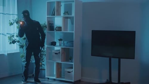 Man in Ski Mask With Crowbar at Night