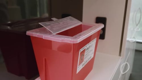 Medical Waste Container in Hospital with Liquid Vial