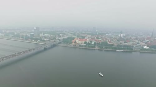 Aerial drone shot over beautiful panoramic view of St. Peter's Church and the Old Riga Town, Latvia