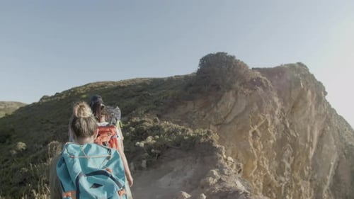 Family Climbing Up Mountain Hill Walking Along Hiking Trail