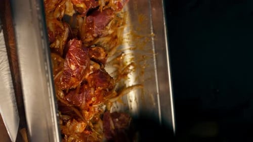 Vertical Video Close Up in a Restaurant in a Rib Bar in the Central Hall Chef in Black Gloves Kneads