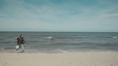 Traveler with backpack walk on seaside