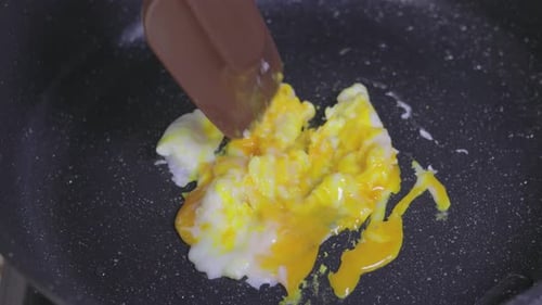 Egg Cooking in a Pan with Spatula