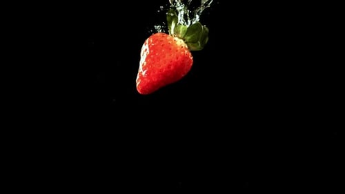 Strawberries Fall Underwater with Bubbles