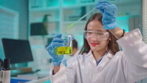 Female Scientist Working with Liquids in Lab