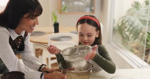 Woman and Girl Baking Together in Home Kitchen
