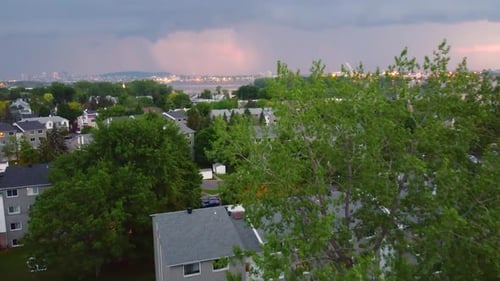 Major Rain Storm in Distance from Montreal Suburbs at Sunset