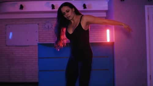 Attractive Talented Woman Dancing Modern Choreography on Blue Neon Background in Studio