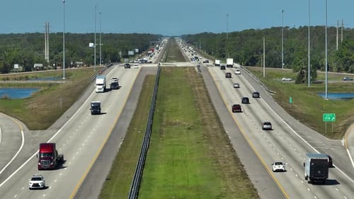 Top View of Mulitlane American Highway with Rapid Driving Cars During Rush Hour in Florida View From