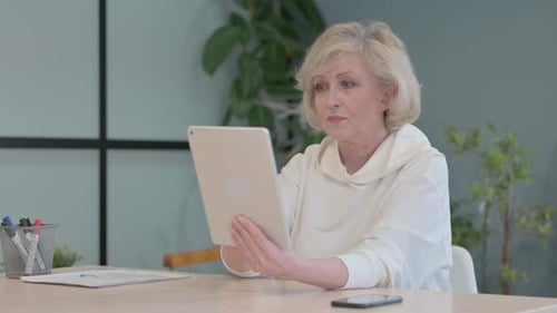 Senior Woman Enjoying Video Call on Tablet