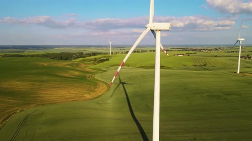 Wind Energy Turns Into Electricity By Generator Countryside Wind Turbine Spinning Against Farm