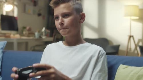 Boy Playing Console Game