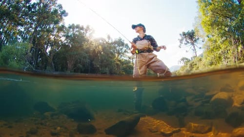 Angler in the River Underwater View