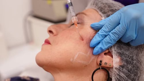 Woman Receiving Biostimulator Collagen Injection Treatment