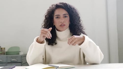 Happy Latin Business Woman Having Hybrid Meeting Talking to Web Cam in Office