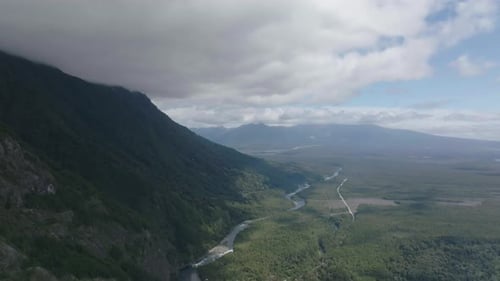 Mountain Valley with River Flowing to Blue Lake
