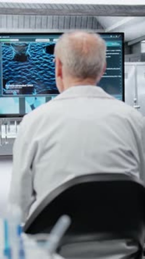 Vertical Video Medical School Professor Mentoring Researchers About Molecular Biology