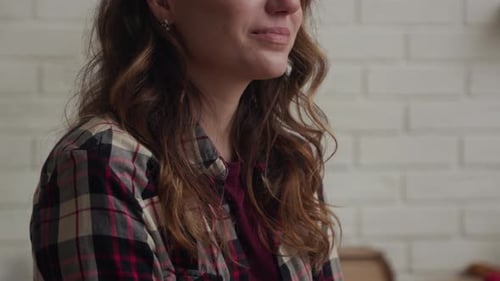 Emotional Young Woman Crying Indoors in Close Up