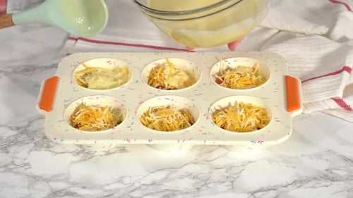 Preparing Egg Bake in a Blue Muffin Tin