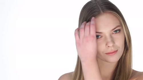 Blonde Woman Touches Her Hair in Close Up