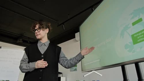 Low Angle of Woman Presenting Health Supplement Slide during Seminar