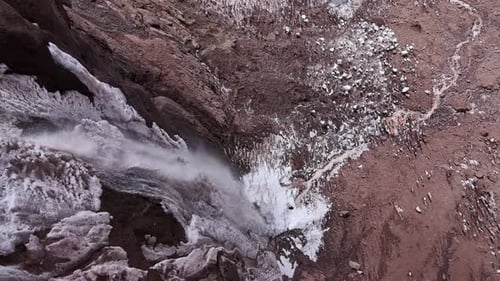 Drone View of Glacial Meltwater Plunging Down Cliffs in the Andes Argentina