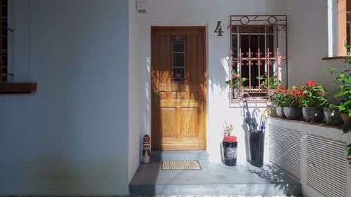 Exterior View of Urban House with Open Door