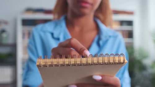 Closeup Notepad in Hands Casual Young Woman Making Writing with Pen