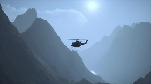 A Helicopter is Flying Over a Mountain Range