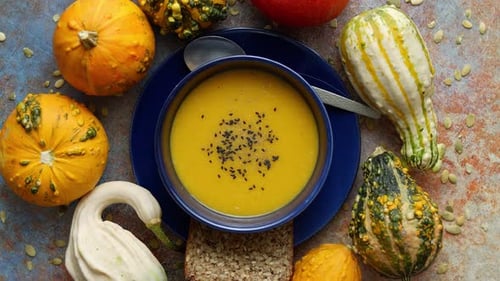 Pumpkin Puree Isoup in Bowl Over Rusty Stone Background