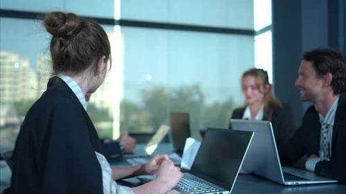 Business Team Meeting at Conference Table