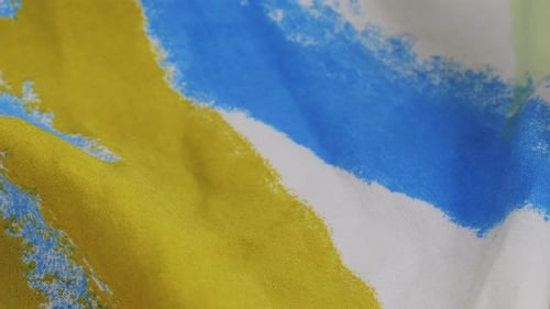 Textured Fabric with Yellow, Blue, and Green Pattern