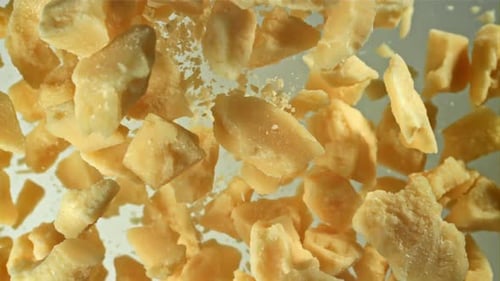 Parmesan Cheese Flies Up and Falls Down Filmed on a Highspeed Camera at 1000 Fps