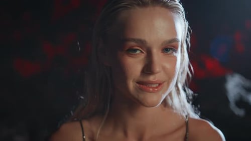 Blonde Woman with Wet Hair and Fashion Makeup