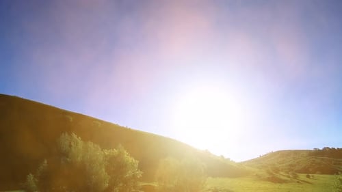 UHD Mountain Meadow Timelapse at the Summer Clouds Trees Green Grass and Sun Rays Movement