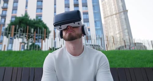 Man Outdoors Using Virtual Reality Headset