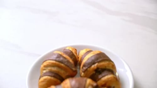 Chocolate Croissants on a Plate in Close Up