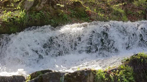 Waterfall Closeup Nature and a Rapid River Stream of Water in the Mountains