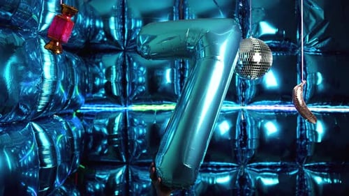 Blue Number Seven Balloon Against Shiny Background