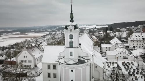 Rising Drone Snowy Church Tower Reveal