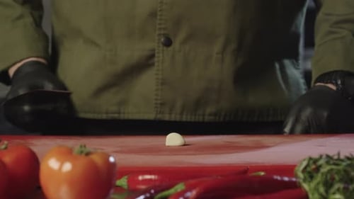 Chef Dicing Garlic in Commercial Kitchen Close Up