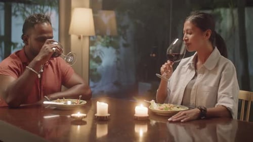 Couple Enjoying Romantic Candlelit Dinner Together