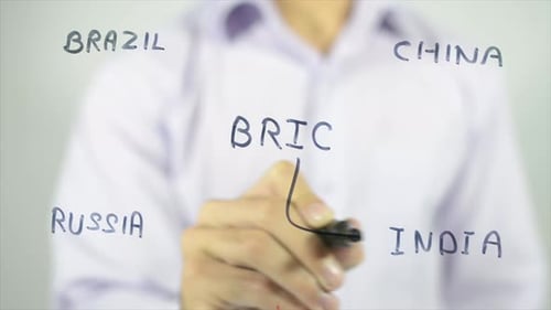 Hand Writes the Word BRIC and Related Countries