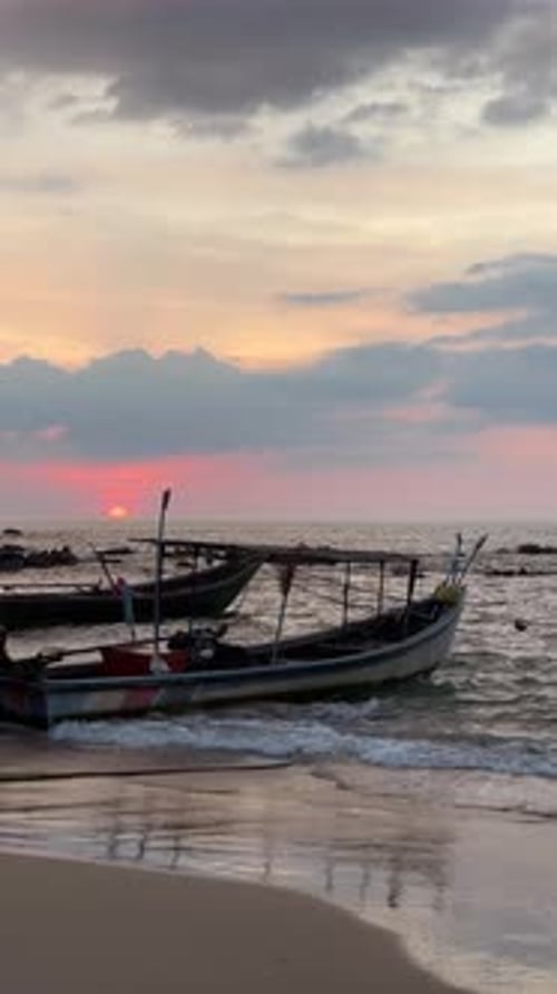 Fishing Boats on Beach at Sunset