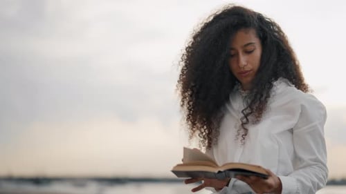 Beautiful Biracial Lady Reading Book Portrait on City Quay in Sunset Slowmo Relaxation and Rest in