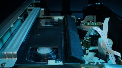 VHS PLAYER Old Video Recorder Inside Closeup VHS Retro Player in Neon Blue Light Vintage Video