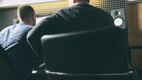 Unrecognizable Young Male Audio Editor and Music Producer Working in the Recording Studio Sound