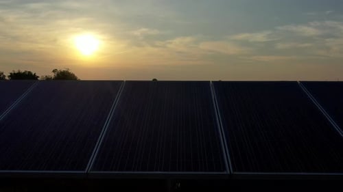Aerial view of solar panels stand in a row landscape electrical power