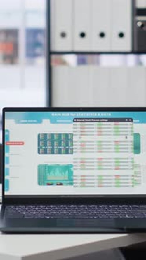 Vertical Video Financial Analyst Workspace Featuring Devices Displaying Stock Market Data